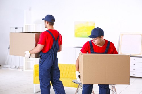 Professional team handling an upright piano removal in Lewisham