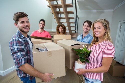 Flat removals team preparing boxes in Lewisham apartment building