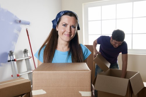 Local movers managing heavy furniture removals in Lewisham street setting