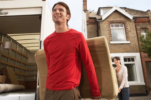 Professional movers loading furniture for a quick Lewisham relocation