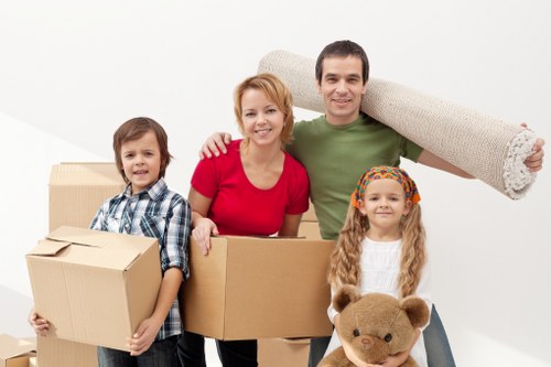Professional man and van loading furniture in Lewisham
