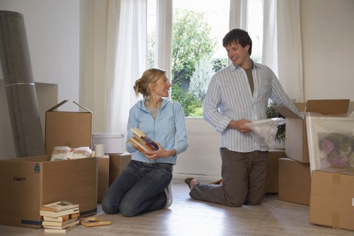 Trained staff handling boxes carefully during a Lewisham move