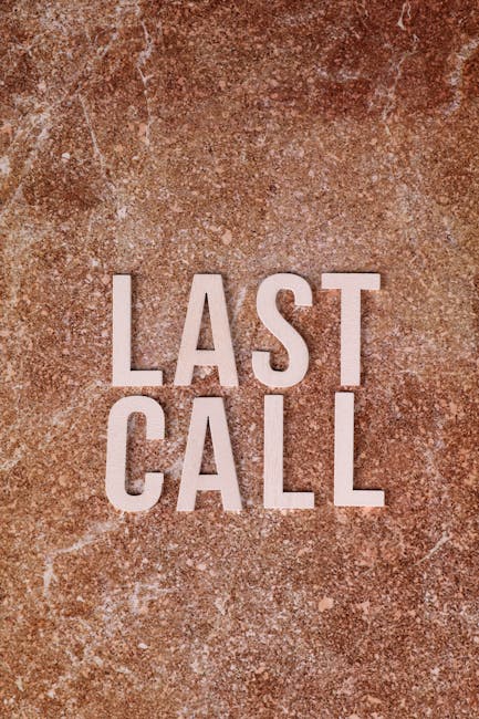 Close-up of a textured, reddish-brown concrete surface with the words 'LAST CALL' written in bold, uppercase white letters. The surface appears weathered, with visible cracks and uneven coloration, su